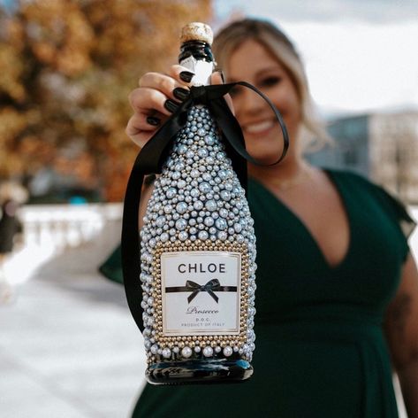 "This bedazzled champagne bottle is designed bead by bead. This bottle is perfect for weddings, engagements, bachelorette parties, birthdays, or anything else you are looking to celebrate!  If you would like something other than white and gold, please message me or put it in the \"notes to seller\". I am happy and able to do almost any color!  Please note: Due to Etsy restrictions, this is for the bedazzling add-on only. The alcohol must be purchased separately. Please message me after your purc Diy Bedazzled Bottle, How To Bedazzle Liquor Bottles, Graduation Bottle Decoration, Decorative Champagne Bottles, Decorating Liquor Bottles, Champagne Bottle Centerpiece, Decorating Champagne Bottles, Prosecco Bottle Decoration, Champagne Party Decor