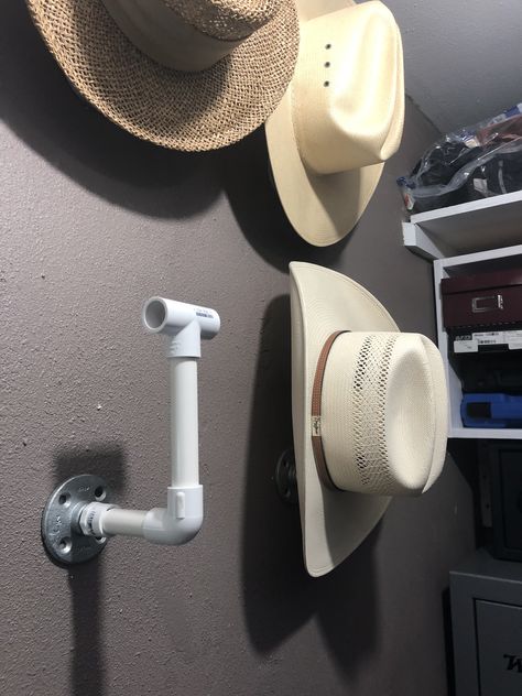 Easy to do, perfect for men’s sun hats or cowboy hats! Cheaper with the PVC pipe, you can always paint with hammered spray paint if you want the metallic look! Diy Cowboy Hat Holder, Cowboy Hat Rack Diy Wall Mount, Cowboy Hat Holder For Truck Diy, Western Pallet Hat Wall, Welded Hat Rack, Cowboy Hat Hanger, Weatern Hat Rack, Diy Hat Rack, Cowboy Hat Rack