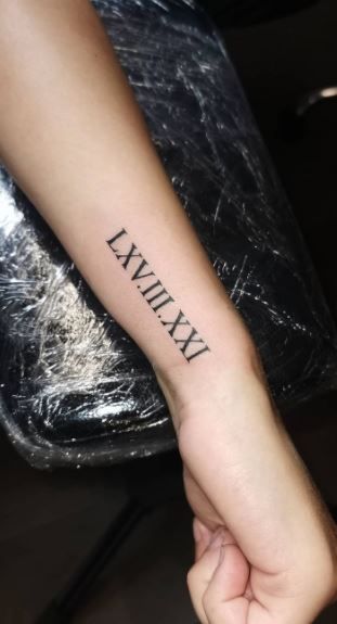 Side Wrist Tattoos Roman Numerals, Forearm Roman Numeral Tattoo, Roman Numeral Tattoo Men Forearm, Roman Numeral Tattoo Forearm, Roman Numeral Birthday Tattoo, Roman Numeral Tattoo Men, Roman Numeral Tattoo Arm, Roman Numeral Wrist Tattoo, Roman Numeral Tattoo Font