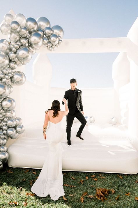 Planning/Venue: @the_grandview Florist: @tkfloraldesignshv Styling: @wylde_rose_events Hair & Makeup: @rb_artistry Signage: @kn_craftsandcreations Cake: @kakes_by_kasey Disco Ball Install: @vividevent Bounce House: @time2partyny Champagne Tower Backdrop: @creative_crafting_by_cynthia Marquee LOVE: @alphalitridgefield Dresses: @blush_bridal_btq Models: @raychherrera Models: @tkfloraldesignshv Stationary: @olivelanepaperie Denim Pearl Mrs. Jacket: @gemini.fusion Wedding Reception Bounce House, Wedding Bounce House, Party Rental Ideas, Moon Bounce, Champagne Tower, Blush Bridal, Outdoor Wedding Reception, Bounce House, Wedding Rentals