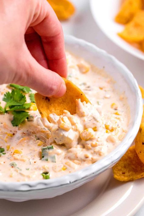 This creamy corn dip is loaded with big Tex-Mex flavors, sweet corn, and lots of cheese. It's always a crowd-pleaser! Dip With Fritos, Corn Dip With Fritos, Cold Corn Dip, Spicy Corn Dip, Creamy Corn Dip, Corn Dip Recipe, Cheesy Corn Dip, Party Meals, Corn Dip Recipes