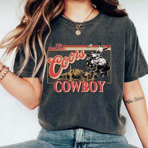 Coors Cowboy Tee Vintage Inspired Tee Shirt, Western Graphic Tee, Retro Tee Shirt, Comfort Colors®, Western American Rodeo Shirt, Country Tee, Country Coors Tee, Country Themed Tee, southern Tee, western tee, boho country tee, Country concert tee, Coors Banquet, Coors Cowboy. Perfect for a country night out, country concert, country and western style party. Country Music Shirts, Rodeo Shirts, Cowgirl Shirts, Boho Aesthetic, Aesthetic Shirts, Country Shirts, Coors Light, Cow Boy, Western Shirt