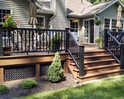 35 Unique Deck Railing Ideas | Sebring Design Build Non Wood Deck Ideas, Gray House Brown Deck, Unique Deck Railing Ideas, Patio Plan, Skirting Ideas, Wood Deck Railing, Backyard Decks, Deck Skirting, Deck Railing Ideas