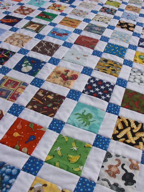 Here's how to make an I-Spy version of the Disappearing Nine-Patch. It's SO EASY, but it looks like you spent FOREVER on it! I am assumi... Disappearing Nine Patch, Bedding Quilts, 9 Patch Quilt, I Spy Quilt, Nine Patch Quilt, Childrens Quilts, Quilt Baby, Nine Patch, Quilted Table