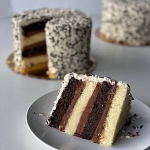 Black-and-White Layer Cake Recipe | Food Network Kitchen | Food Network White Layer Cake, Cake Boss Buddy, Cake Boss Recipes, Black And White Cake, Brownie Desserts Recipes, Carlos Bakery, Buddy Valastro, Chocolate Fudge Frosting, White Cakes