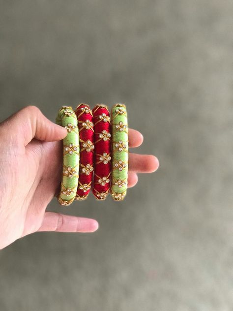 It's realy good one Silk Tread Jwellary, How To Wrap Bangles For Gift, Unique Bangle Designs, Simple Thread Bangles Designs, Silk Thread Bangles Design Kundan, Thread Bangle Designs, Thread Bangles Designs, Tread Bangles, Silk Thread Earrings Designs