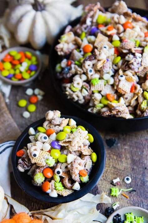 This white chocolate Halloween snack mix is a quick and easy recipe that is perfect for after-school snacking and Halloween parties. It comes together in minutes, is super tasty and and is versatile, allowing you to sub in other ingredients based on your preferences. Halloween Snack Mix White Chocolate, Halloween Snack Mix With Candy Corn, Snack Mix With Bugles And Candy Corn, Sweet And Salty Halloween Chex Mix Recipes, Halloween Popcorn Mix Monster Munch, Halloween Charcuterie Board, Halloween Snack Mix, Chocolate Halloween, Halloween Charcuterie