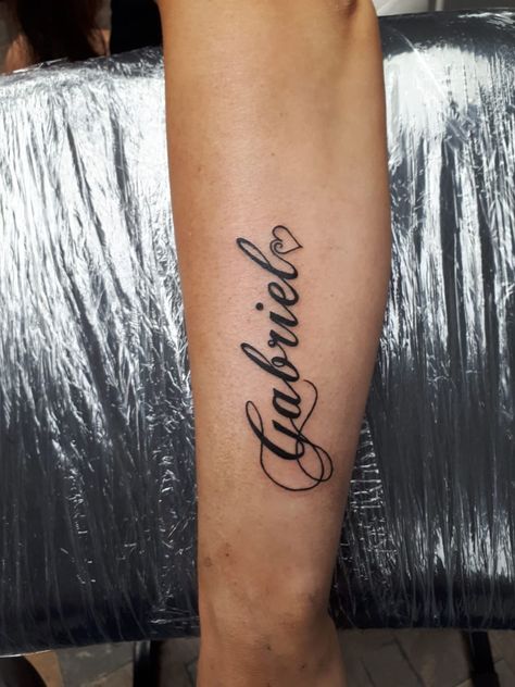 Gabriel Tattoo Design, Forearm Name Tattoos For Women, Chest Name Tattoo Female, Partner Name Tattoos, Small Name Tattoos, Gabriel Tattoo, Luis Tattoo, Small Name Tattoo, Forearm Name Tattoos