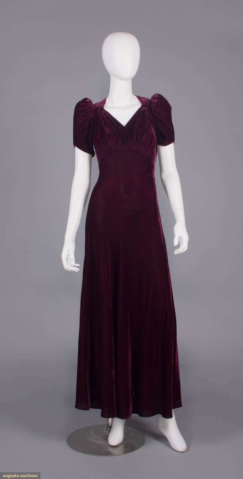 Maroon silk velvet w/ sweetheart neckline created by horizontal self bands under clavicles, short padded puff sleeve, ruched SHs, under B & CB of ankle length flared skirt, B 40", W 25", L 59", (few small areas of crushing, 0.5" seam opening left W & 0.75" right W & SS) 40s Dresses Formal, 40s Dresses, 40s Outfits, Velvet Evening Dress, 40s Dress, Royal Outfits, Clothing And Textile, Vintage Gowns, Couture Vintage