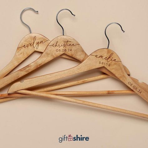 Add a personal touch to your bridal party with our Custom Bridesmaid Hangers. Perfect for those special dresses, these wooden hangers make a beautiful keepsake for your bridesmaids. 👗💖 Buy now. Link in story!👆🏻 #giftshire #gift #personalizedgift #giftideas #customgifts #bridesmaidhanger Bridesmaid Hanger, Bridesmaid Hangers, Custom Hangers, Wooden Hanger, Personalized Bridesmaid Gifts, Special Dresses, Bridesmaids Personalized, Wooden Hangers, On Your Wedding Day