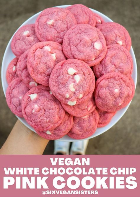 These pink and white cookies are the ultimate V-Day treat! They're a cross between a sugar cookie and a chocolate chip cookie, with a festive twist. They're soft, chewy, and bursting with white chocolate chips. #vegan #vegandesserts #vegancookies #cookies #cookierecipe #valentinesday #valentinesdaydesserts #sixvegansisters Pink Party Snacks, Six Vegan Sisters, Pink Party Foods, Pink Snacks, Pink Treats, White Cookies, Vegan White Chocolate, Pink Desserts, Pink Cookies