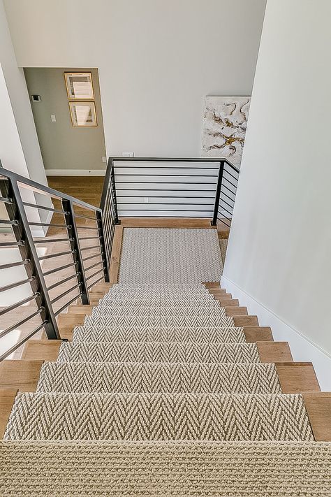 Beautiful stair runner with wood trim. Part of the 2019 parade of homes Stairs With Carpet Runner And Wood, Wood Carpet Stairs, Carpet With Wood Trim, Wood Stairs Runner, Stair Runner Inspiration, Farmhouse Stair Runner Ideas, Printed Carpet On Stairs, Stair Runner Wood Stairs, Stairs With A Runner