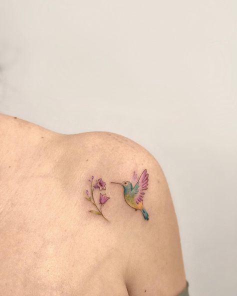 27 Hummingbird Tattoo Ideas In a Variety of Styles | These hummingbird tattoo ideas range from minimalist to photorealism. There's something for every taste. Lifestyle Hummingbird Tattoo Color, Hummingbird Tatoos, Colorful Hummingbird Tattoo, Americana Tattoo, Tattoos For Women Flowers, Hummingbird Tattoo, Tasteful Tattoos, Fairy Tattoo, Badass Tattoos