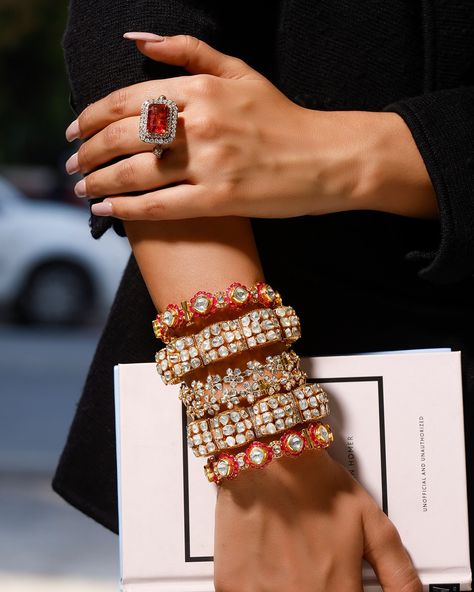 Elevate your style with these stunning 3 pairs of polki bangle sets and a bold ring! First up, the ethereal polki “Gajra” duo, stacked with the charming pair of polki bangles adorned with floral designs delicately crafted in 14 K gold. And finally, the pièce de résistance - our handcrafted Pacheli bangle pair, meticulously fashioned in 18kt gold, embellished with radiant rubies, dazzling polkis, and petite diamonds for that extra sparkle. The mesmerizing red of tourmaline pink stone ring in ... Pacheli Bangle, Polki Bangles, Pink Stone Ring, Bridal Jewellery Inspiration, Pink Stone Rings, Bold Rings, Jewellery Inspiration, Stacked Bangles, Fine Jewels