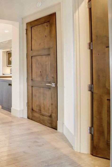 Wood Doors With White Trim Interior, Walnut Doors With White Trim, Interior Wood Doors With White Trim, Dark Wood Interior Doors, White Trim Brown Doors, Wood Trim And Doors, Knotty Alder Doors With White Trim, Dark Interior Doors With White Trim, Interior Door Design