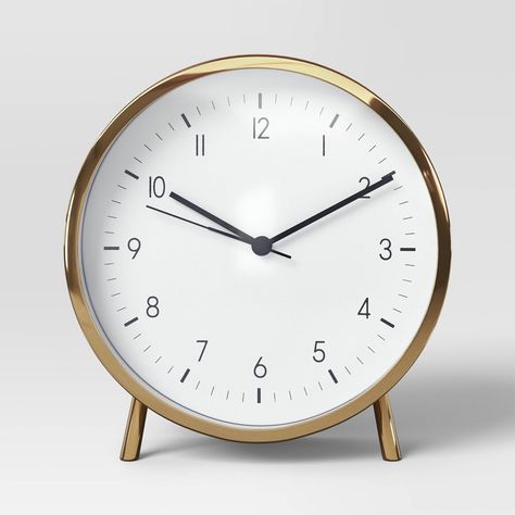 Introduce a minimal yet catchy timepiece to your space with the 6" Polished Metal Mantle Clock with Alarm Brass from Threshold™. This analog clock features a classic white clock face, beautifully complemented by its metal construction. With it's polished design it makes for a great piece that seamlessly brings together style and functionality. Threshold™: Looks like home, feels like you. Metal Mantle, White Clock, White Clocks, Table Clocks, Analog Clock, Alarm Clocks, Mantle Clock, Tabletop Clocks, School House