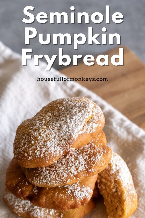 Pieces of pumpkin frybread sprinkled with powdered sugar and arranged on a cloth napkin that sits on top of a wooden cutting board. The words Seminole Pumpkin Frybread overlay the image at the top, along with the URL housefullofmonkeys.com Easy Native American Recipes, Frybread Native American, Native American Bread Recipe, Native American Food Recipes Authentic, Cherokee Recipes, Seminole Pumpkin, Native Recipes, Native American Recipes, Appalachian Recipes