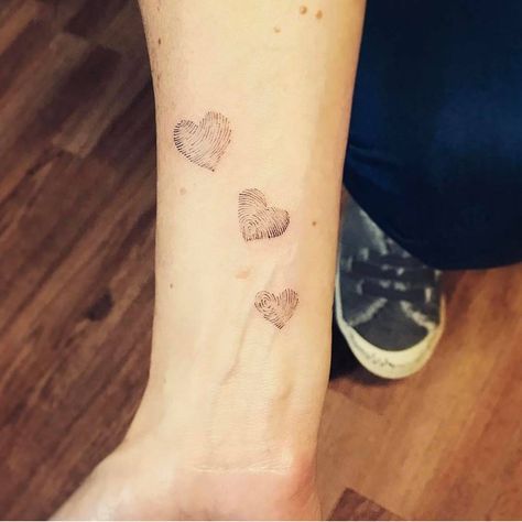 Family fingerprints tattoo on the inner forearm. 3 Thumbprint Tattoo, 3 Finger Print Tattoo, Three Fingerprint Tattoo, Three Thumbprint Tattoo, Family Finger Print Tattoo, Finger Print Tattoo Ideas Family Trees, Family Fingerprint Tattoo, Thumbprint Flower Tattoo, Finger Print Flower Tattoo