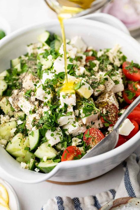 Tired of the same old salads? Looking for something fresh and delicious to add to your summer menu? Take a look at this delectable cucumber tomato feta salad! This light, flavorful Greek salad combines juicy tomatoes, crisp cucumbers, creamy feta cheese, and fragrant herbs. All tossed together in a simple oil and vinegar dressing that ties it all together. Perfect for a hot summer day or as a side dish to any meal! Tomato Cucumber Feta Salad, Cucumber Tomato Feta Salad, Oil And Vinegar Dressing, Tomato Feta Salad, Cucumber Feta Salad, Different Salads, Creamy Feta, Clean Eating Chicken, Cucumber Tomato Salad