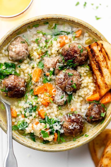 Load up on protein, complex carbs, and nutritious vegetables with this Italian Wedding Soup Recipe. From the meatballs to the pasta, it's got it all. The dish serves 12! Erin Lives Whole Italian Wedding Soup, Wedding Soup Recipe, Erin Lives Whole, Healthy Italian Recipes, Italian Wedding Soup Recipe, Nutritious Dinner, Cheese Burger Soup Recipes, Italian Diet, Complex Carbs