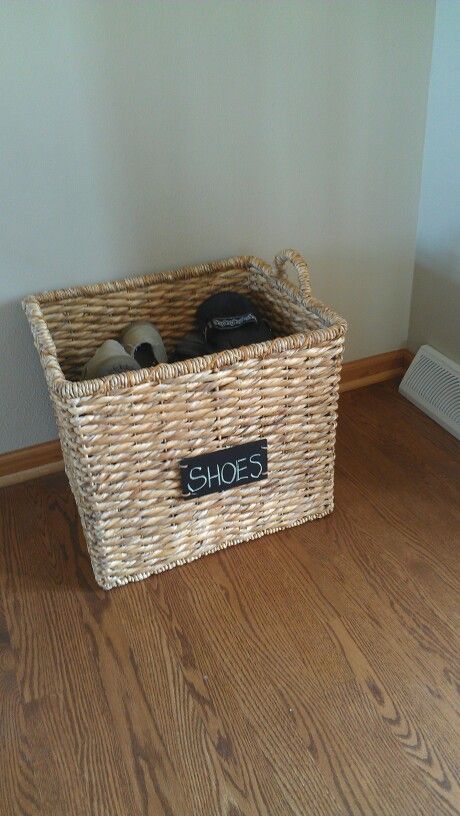 Keep your shoes out of site in a storage basket. Shoe Basket Entryway Small Spaces, Shoe Bins Entryway Baskets, Shoe Storage Ideas Baskets, Basket For Shoes Entryway, Shoe Basket Ideas, Shoe Basket Entryway, Shoe Basket By Door, Shoe Storage Basket, Shoe Basket