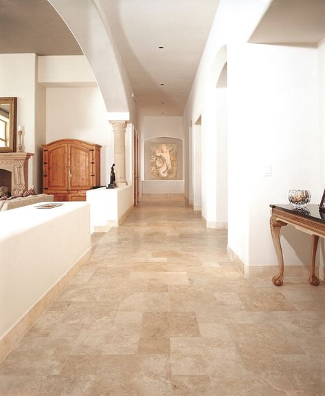 Wood Baseboards vs. Tile Baseboards | Hunker Tile Baseboard, Travertine Floor Tile, Stone Entryway, Travertine Floor, Wood Baseboard, Tile Floor Living Room, Dining Room Remodel, Travertine Floors, Living Room Tiles