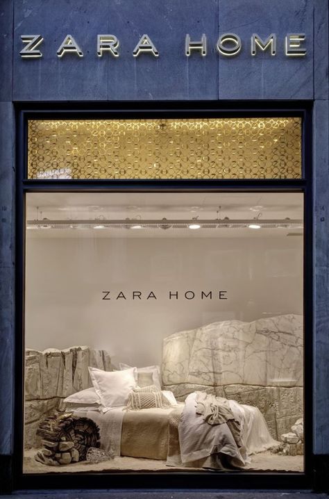 Zara Home Windows, Milan – Italy. This window Display is different because it takes home items such as a bed and puts it in an unlikely place, the desert. The stone in the back helps bring out the neutral, dry feeling. Olivia Sherles Fabric Window Display, Window Display Design Creative, Creative Window Display, Zara Home Interiors, Furniture Store Display, Italy Houses, Shop Curtains, Store Display Design, Windows Display