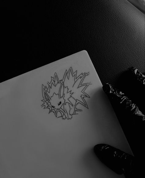 Jolteon tattoo, pokemon tattoo Jolteon Tattoo Ideas, Jolteon Tattoo, Pokemon Line Art Tattoo, Leafeon Tattoo, Pokemon Tattoo Ideas Black And White, Jolteon Art, Pokemon Tattoo, Sketch Tattoo, Cute Small Tattoos