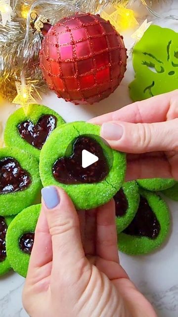 Sasha Nary / Aleksandra Naryzhny on Instagram: "Grinch Thumbprint Raspberry Cookies!💚❤️ Despite the amount of ... comments, my popular recipe for these mega delicious and soft cookies remains the same, you guys!!😆 Sound and eyes on! Scooping into the measuring cup and leveling it after (vs. scooping out of bag/container with that cup) OR using kitchen scale (sighhhh) is going to SAVE CHRISTMAS and the GRINCH! 😅 LOVE YOU, HAPPY HOLIDAYS!💚❤️ Oh, that's a recipe 23 of my 24 Days Of Christmas Cookies Recipes!🎄 (see stories for detailed and slower video!)

You will need:

2 cups (250 g) all-purpose flour
3 tbsp (22 g) cornstarch
3/4 tsp (3 g) salt 
3/4 cup (75 g) powdered sugar
1/2 cup (113 g /1 stick) unsalted butter, room temperature
1 large egg, room temperature 
1 tsp lemon juice or le Grinch Thumbprint Cookies Raspberry, Grinch Raspberry Thumbprint Cookies, Grinch Thumbprint Raspberry Cookies, Grinch Thumbprint Cookies, 24 Days Of Christmas, Raspberry Thumbprint Cookies, Christmas Cookies Recipes, Grinch Heart, Grinch Cookies