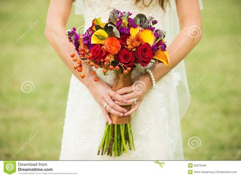 Photo about Bride holding wedding bouquet with Rose Hips, Smokebush, and yellow Calla Lilies. Image of dress, hands, occasion - 52979448 Lilies Purple, Irish Wedding Vows, Diy Fall Wedding Decorations, Orange Dahlias, Fall Wedding Arches, Roses Orange, Cheap Wedding Centerpieces, Burgundy Dahlia, Autumn Wedding Reception