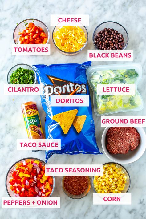 This Dorito Taco Salad is a fun 20-minute dinner idea made with crunchy Cool Ranch Doritos, fresh veggies, cheese and taco sauce. Dorito Taco Salad, Cool Ranch Doritos, Dorito Taco, Taco Salad Doritos, Doritos Taco, Sauteed Peppers And Onions, Taco Salad Recipe, 20 Minute Dinners, Beef Sauce