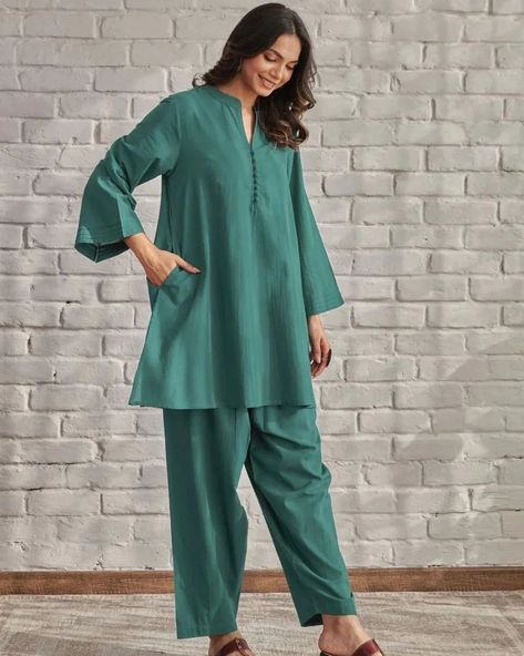 ₹825  *😍😍New Design Launched😍😍*  *Introducing our Solid Colors Cotton Coord Set – a timeless classic for versatile elegance. This ensemble exudes sophistication in its simplicity, featuring a solid green hue that transcends trends. Crafted from comfortable cotton, the set includes coordinated pieces for a effortlessly polished look*  Color : YamaGreen, Maheroon, Black, TealBlue  Style : Loose Sleeve Style : full lengths  Measurements :  Top Length : 34 "  Bottom Length : 36"   *Fabric: C... Matching Top And Pants Set, Dress Design Pakistani, Coordinates Outfits, Coord Set, Solid Green, Top And Pants Set, Co Ord Set, Kurti Designs, Co Ord