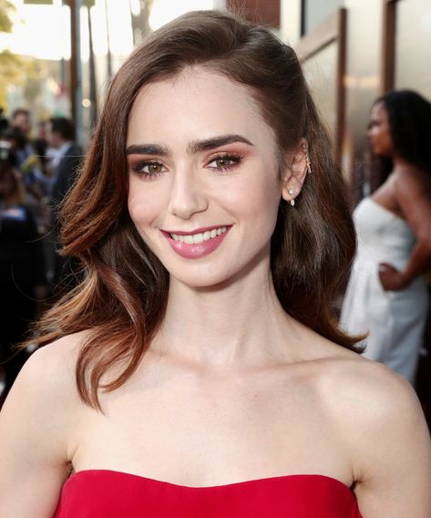 Lily Collins  | The right haircut will enhance your best features and beauty, but you can't choose the best style for you without knowing what cuts flatter your face shape. Here, we've rounded up the best haircuts for heart-shaped faces. Lily Collins Hair, Heart Face, Heart Face Shape, Lily Collins, Hair Fragrance, Cool Haircuts, Bob Wigs, Face Shapes, Lace Wigs