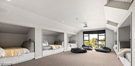 Upstairs is a children's dream room complete with six bunk beds and a cinema screen that d... Attic Dormitory, Attic Bunk Room Sloped Ceiling, Bunk Beds Built In, Built In Bed, Bunk Rooms, 6 Bedroom House, Bunk Bed Designs, Attic Bedroom, Bunk Room