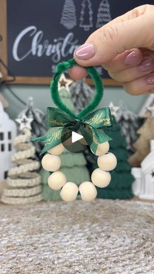 1.2M views · 6.3K reactions | Mini wooden bead wreath, I used a craft pipe cleaner and 10 wooden beads, size 15mm with a 6mm hole and I added a little ribbon to finish the wreath. So simple to make a very easy diy Christmas craft idea 🌲❤️#miniwreaths #woodenbeadwreath #diychristmascrafts #christmascraftideas #diychristmasdecoration #diychristmasornament | Caroline Fleming Wooden Bead Wreath, Bead Wreaths, Caroline Fleming, Craft Pipe Cleaner, Bead Wreath, Christmas Trimmings, Easy Christmas Ornaments, Diy Christmas Ornament, Wood Wreath