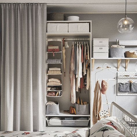 no matter how organized your wardrobe is, sometimes you’ll want your stuff out of sight. If wardrobe doors will stretch your budget too far or you don’t have the space to open them, then try hanging a curtain across your open storage instead. Small Space Wardrobe Ideas, Curtain Wardrobe, Armoire Ikea, Design Ložnic, Ikea Interior, Small Bedroom Organization, Closet Curtains, Ikea Wardrobe, Ikea Pax Wardrobe