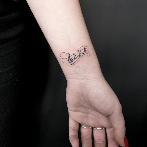 Notes Tattoo Design 3 Music Wrist Tattoos, Tattoo Song, Trumpet Tattoo, Small Music Tattoos, Musician Tattoo, Notes Tattoo, Piano Tattoo, Luna Tattoo, Guitar Tattoo Design