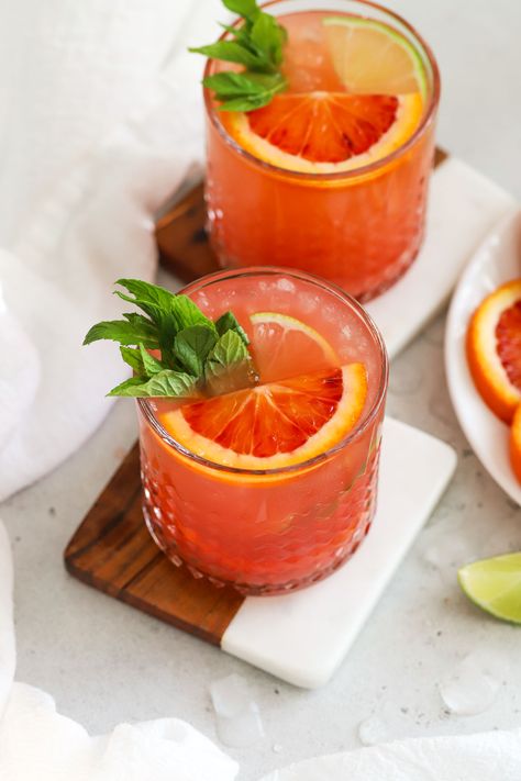 This naturally sweetened Blood Orange Mocktail is the perfect non-alcoholic drink for the holidays + special occasions! Made with vibrant fresh blood orange juice, a twist of lime, a few fresh finishes, and plenty of fizz, this holiday mocktail recipe is PACKED with flavor! As a bonus, this citrus spritzer is also made without refined sugar, so it's paleo approved! Get the recipe and more healthy mocktail recipes to try at One Lovely Life Sugar Free Mocktails Non Alcoholic, Blood Orange Mocktail, Best Mocktail Recipe, Orange Mocktail, Healthy Mocktail, Best Mocktail, Mocktails Non Alcoholic, Holiday Mocktail, Festive Holiday Drinks