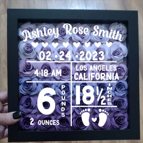 Celebrate the arrival of your little one with this beautifully crafted birth announcement shadow box frame. Inside this 8x8 shadow box are hand rolled roses made of cardstock paper arranged in a beautiful bouquet.

The shadow box is filled with customizable details, including the baby's name, birthdate, weight and height, City and State. Customize the frame color and rose color to match your desired color scheme or nursery decor. Shadow Box Frames, Rose Color, Shadow Boxes, White Vinyl, Beautiful Bouquet, Flower Frame, Cardstock Paper, Birth Announcement, Shadow Box