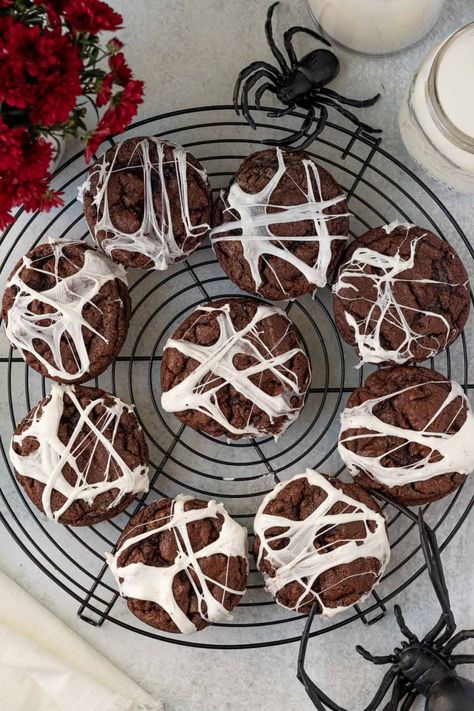 These spooky spider web cookies are the perfect fun treat for Halloween. Bakery sized double chocolate chip cookies form the base for a gooey marshmallow spider web. The cookie dough does not require any chiling so these cookies come together quickly and melted mini marshmallows are easily made into cute spider webs. | themarblekitchen.com Marshmallow Spider Web, Halloween Chocolate Chip Cookies, Marshmallow Halloween, Spider Web Cookies, Chocolate Spiders, Spooky Spider Web, Postres Halloween, Halloween Cookie Recipes, Spider Cookies