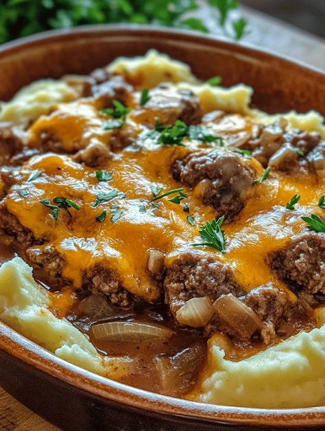 Imagine a sumptuous dish that fills the home with warmth and the irresistible aroma of savory beef and heavenly mashed potatoes. The Hearty Amish Hamburger Steak Bake is just that! This comforting casserole represents the best of traditional Amish cooking, melding the richness of ground beef with hearty vegetables and creamy mashed potatoes topped with gooey cheddar cheese. It’s a meal that n... Beef And Mashed Potato Casserole, Amish Steak Bake, Amish Hamburger Casserole, Ground Beef And Mashed Potatoes, Beef And Mashed Potatoes, Steak Bake, Baked Steak, Mashed Potato Casserole, Hamburger Casserole