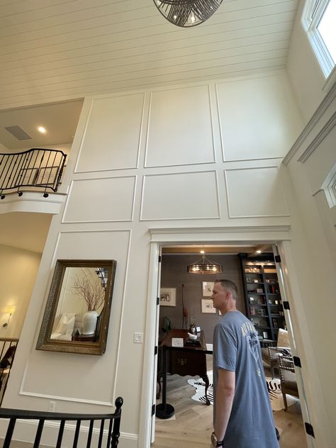 Molding On Tall Walls, Entryway Paneling Entrance, 2 Story Wall Paneling, Tall Ceiling Foyer, Tall Foyer Wall Decor High Ceilings, High Ceiling Foyer Ideas Entryway, Decorating Tall Walls High Ceilings, Entryway Wainscoting Ideas, Tall Entryway Ideas