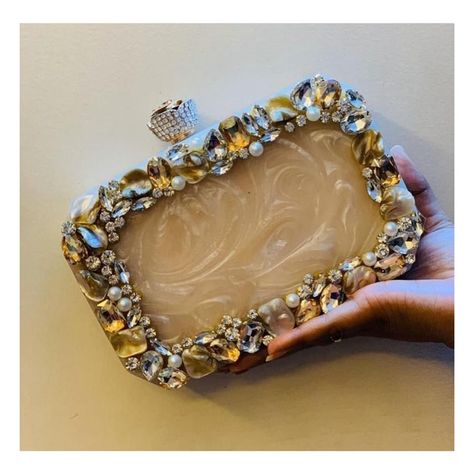 Heavy MOP (Mother Of Pearl) Embellished Resin Clutch Bag 👝 Size - 7 by 5 inch approx Knob - Silver With sling chain Back side plain Code: 0/T15FS Without Name ₹1999/- With Name ₹2099/- Freeship within India ✈️ 8-10 days dispatch time For Heavy Chain ₹50/- extra will be chargeable Shipping worldwide 🌍 DM to order #weddings #jewellery_by_rohika #bridalclutches #rohika #indianwedding #embroideredclutch #clutches_by_rohika #weddingclutch #stonework #resinclutches Plastic Canvas Bags, Indian Clutch, Decorated Bag, Resin Clutch, Clutch Purse Wedding, Purse Wedding, Personalized Clutch, Bags For Ladies, Studded Clutch