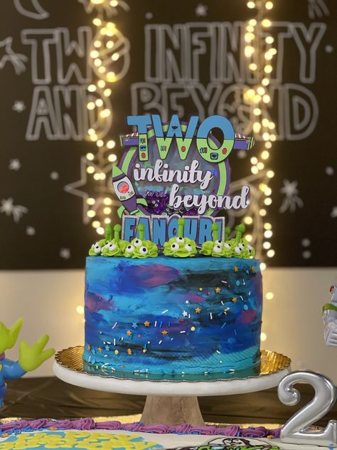 My son’s Buzz Lightyear “Two Infinity and Beyond” birthday cake for his Toy Story themed 2nd birthday party! Galaxy cake made by Gray Barn Baking. Cake topper made by SullyCreations on Etsy! Two Infinity And Beyond Birthday Buzz, Too Infinity And Beyond Birthday Party, 2 Infinity And Beyond Birthday Party Cake, Two Infinity And Beyond Cake Topper, Buzz Lightyear Cake Ideas, Buzz Light Year Birthday Cake, Buzzlight Year Cake Ideas, Buzzlight Year Birthday Theme, Pastel Buzz Lightyear