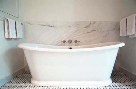 Beautiful bath nook with seamless marble backsplash framing a wall mounted faucet over the freestanding bath tub. Bath Tub Surround, Elizabeth Roberts, Laundry Chute, Clawfoot Tub Faucet, Bathtub Decor, Park Slope, Bath Panel, Transitional Bathroom, Tub Surround