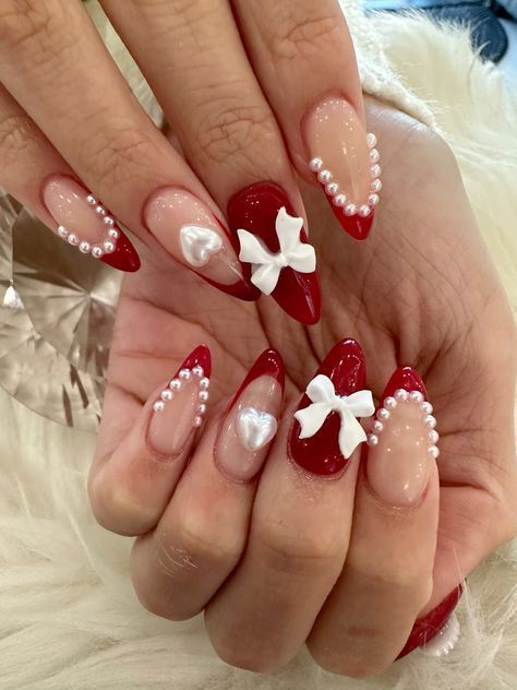 Red Coquette Nail Ideas, Cupid Inspired Nails, Coffin Coquette Nails, Strawberry Coquette Nails, Red Nails Pearls, Heart And Bow Nails, Coquette Nails Acrylic Almond, Croquette Nails Red, Red And Pearl Nails