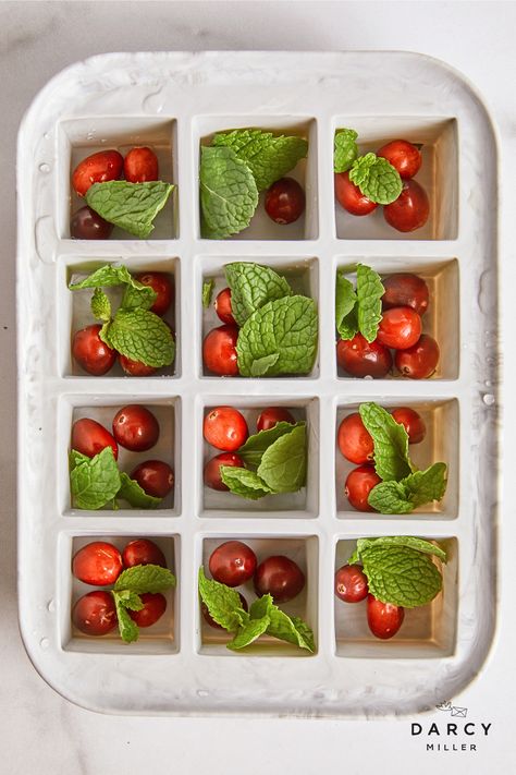 Festive Ice Cubes | Darcy Miller Designs How-to make fun ice cubes #holiday #cocktail #hollyberry #mint #cranberry #easy #diy #decor #celebrate #cocktail #winter #drinking #party Mint Ice Cubes, Christmas Cocktail Party, Christmas Entertaining, Christmas Brunch, Christmas Cocktails, Holiday Cocktails, Noel Christmas, Holiday Drinks, Christmas Drinks