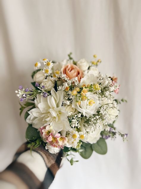 "These beautiful artificial wedding bouquets are made from faux flowers of white, off white and colorful flowers, sage greenery and silk eucalyptus. They will make the perfect addition to your big day!  This bridal bouquet consists of roses, peonies and dahlias with green silk eucalyptus and sage greenery and fillers. The stems are wrapped in twine. The bridal bouquet pictured is 12\" (30 cm). Bouquet Size Available: Bridal Bouquet- 12\" (30 cm) Bridesmaids Bouquet - 7\" (17 cm) Toss bouquet 6\" (15 cm) Matching bridesmaids bouquets, toss bouquet, corsages and boutonnières and other accessories are available." Flowers For A Sage Green Wedding, Cute Wedding Flowers, Simple Pastel Bouquet, Sage Greenery Wedding, Wedding Bouquets Without Roses, Gardina Flowers Wedding, Vintage Bridesmaid Bouquet, Rice Flower Bouquet, Green Wedding Bouquets Eucalyptus