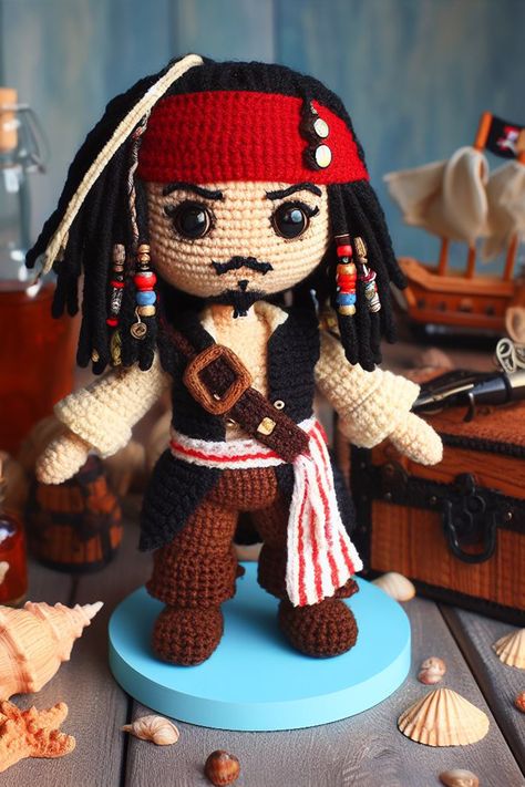 Set sail on a crochet odyssey with a charming Amigurumi that channels the adventurous spirit of the sea’s most whimsical pirate. Pirate Pattern Sewing, Pirates Of The Caribbean Crochet, Crochet Titanic, Sparrow Crochet, Crochet Pirate, Disney Crochet Patterns, Crochet Pattern Instructions, Cozy Crochet Patterns, Crochet Disney