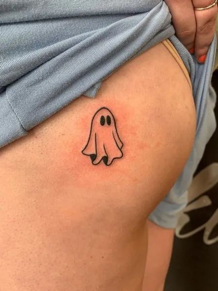 Ghost Butt Tattoo Ghost Tattoo Patchwork, Small Ghost Tattoo Placement, Ghost Ankle Tattoo, Ghost Emoji Tattoo, Ghost Cute Tattoo, Ghost Patchwork Tattoo, Ghost Holding Balloon Tattoo, Punny Small Tattoos, Tiny Jack O Lantern Tattoo